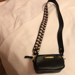 Steve Madden shoulder or cross body bag.  Black with design strap.